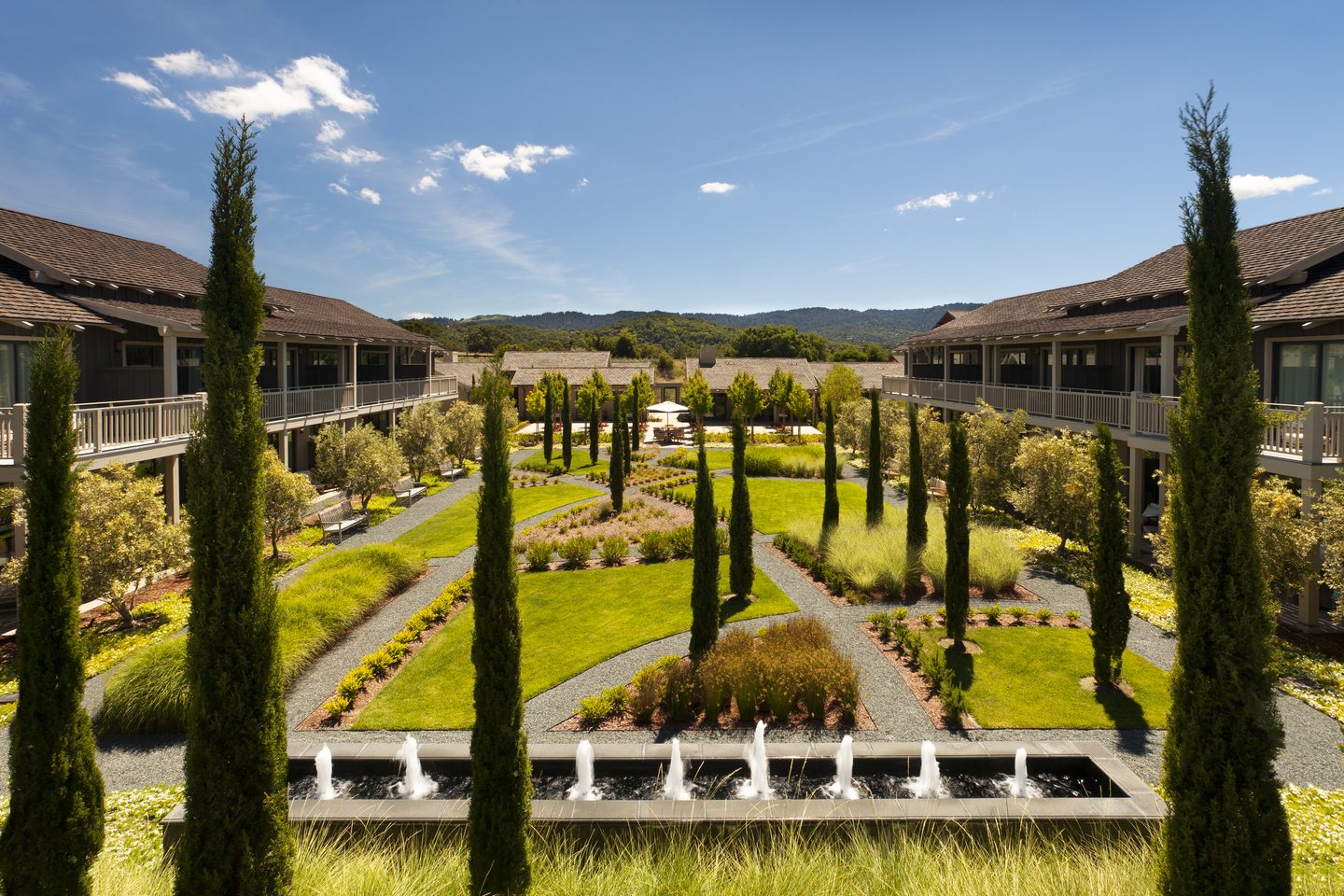 Landscaped courtyard gardens and fountains at Rosewood Sand Hill