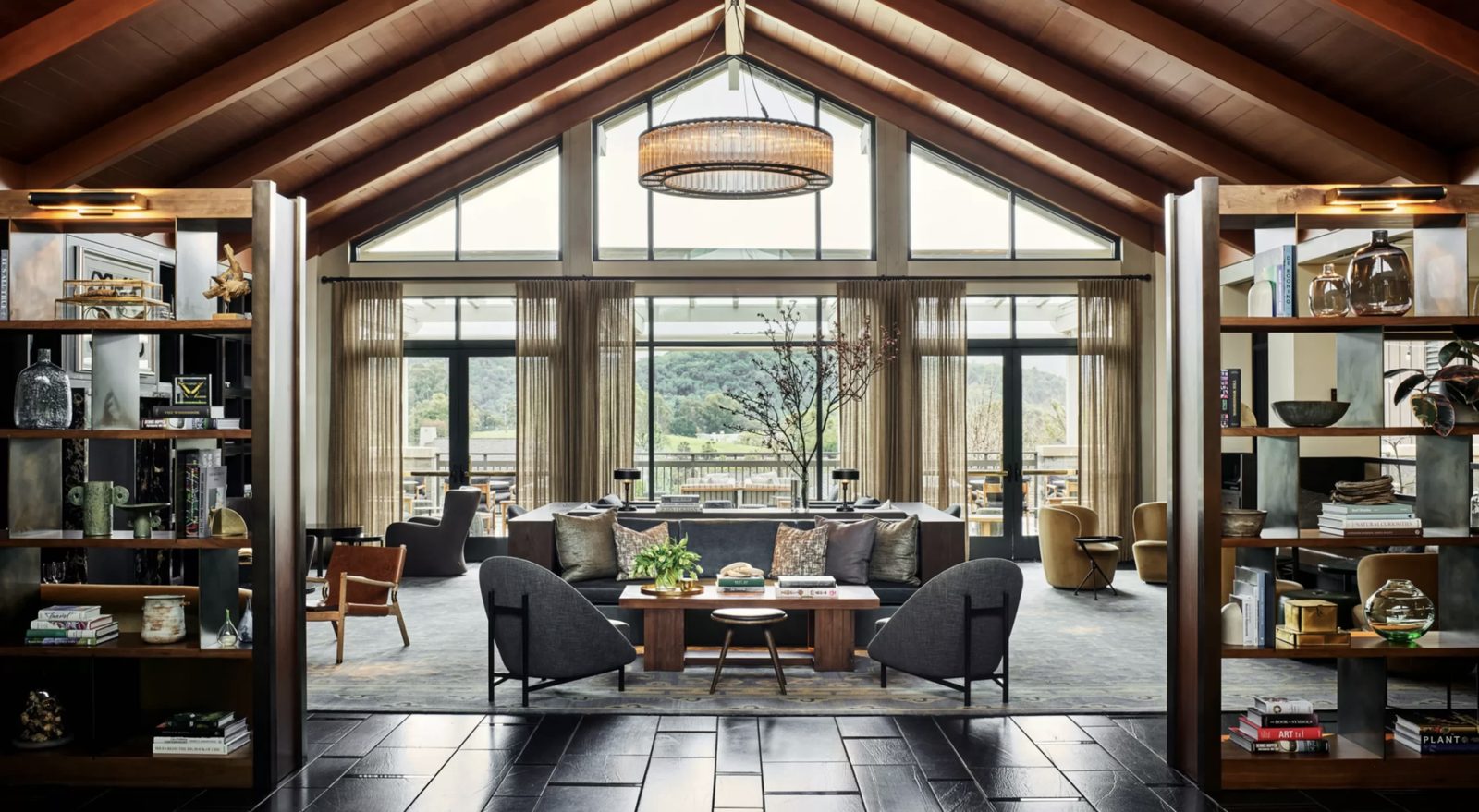 The great room lounge at Rosewood Sand Hill, open-beam ceiling and valley views
